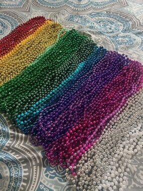 Set of 95 Mardi Gras Beads and 4 little dogs